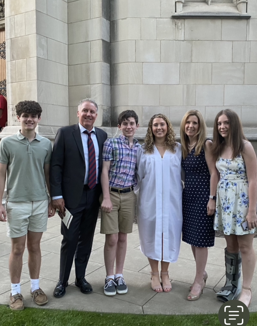 Ms. McPeak pictured with her family at her daughters graduation